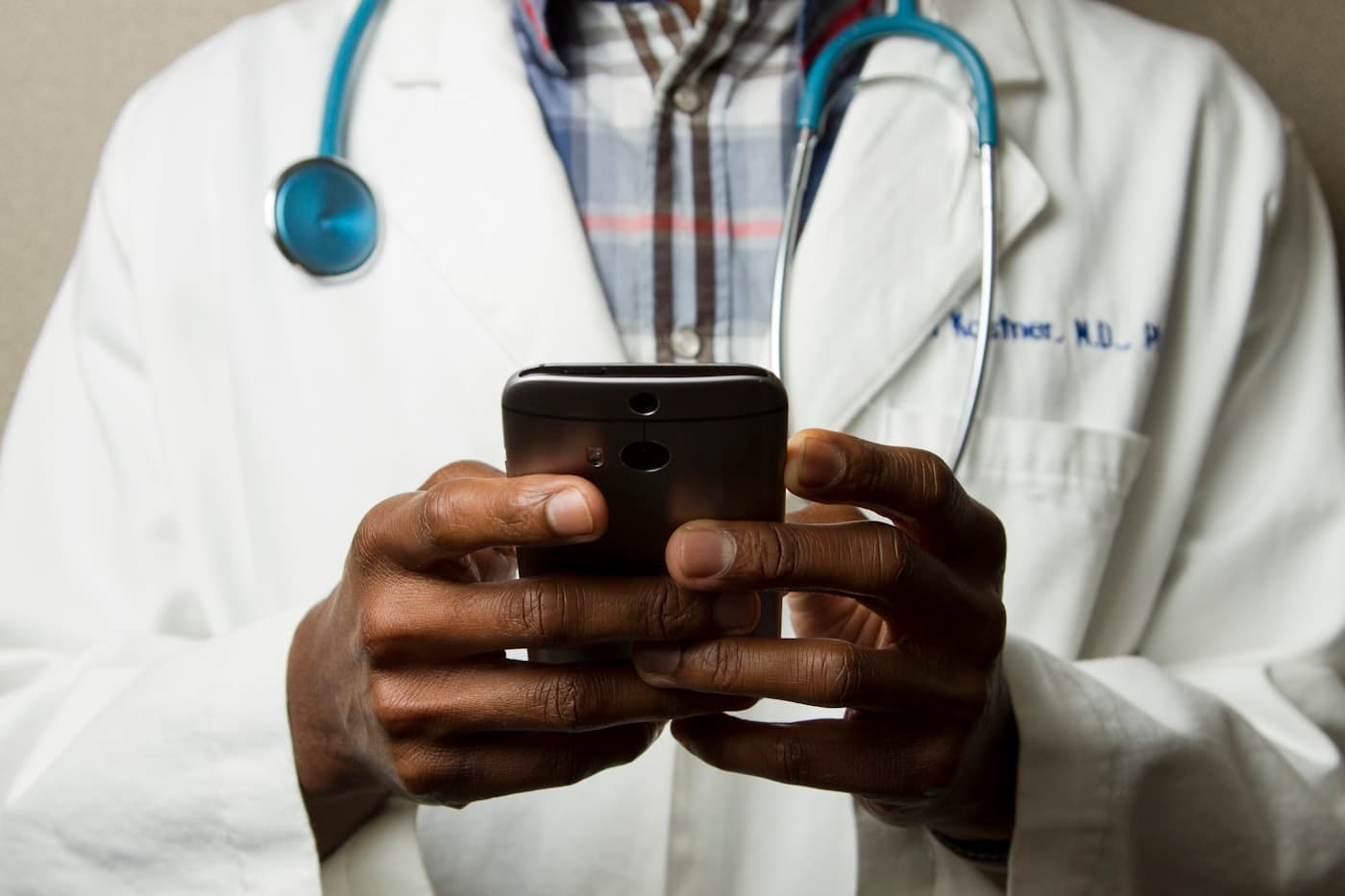 Healthcare professional reviewing clinical data on a digital display